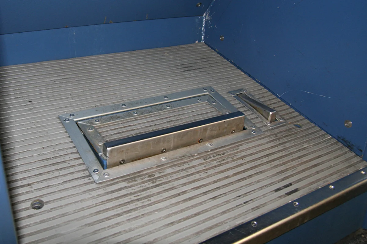 Driver's vigilance pedal in the floor of a locomotive cab